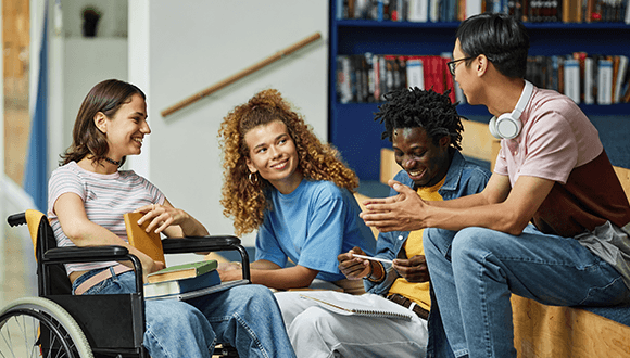 Four students sat together talking